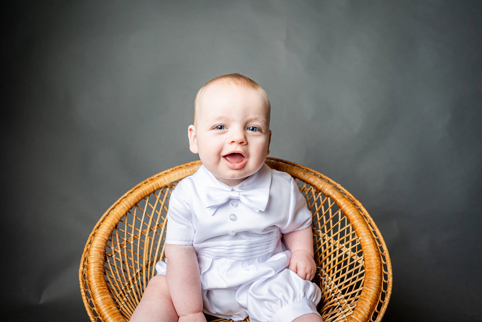Toddler sitting in a chair during a portrait session