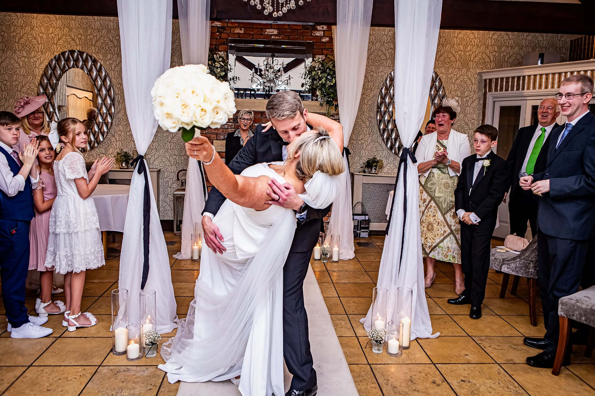 Couple sharing a romantic first dance kiss