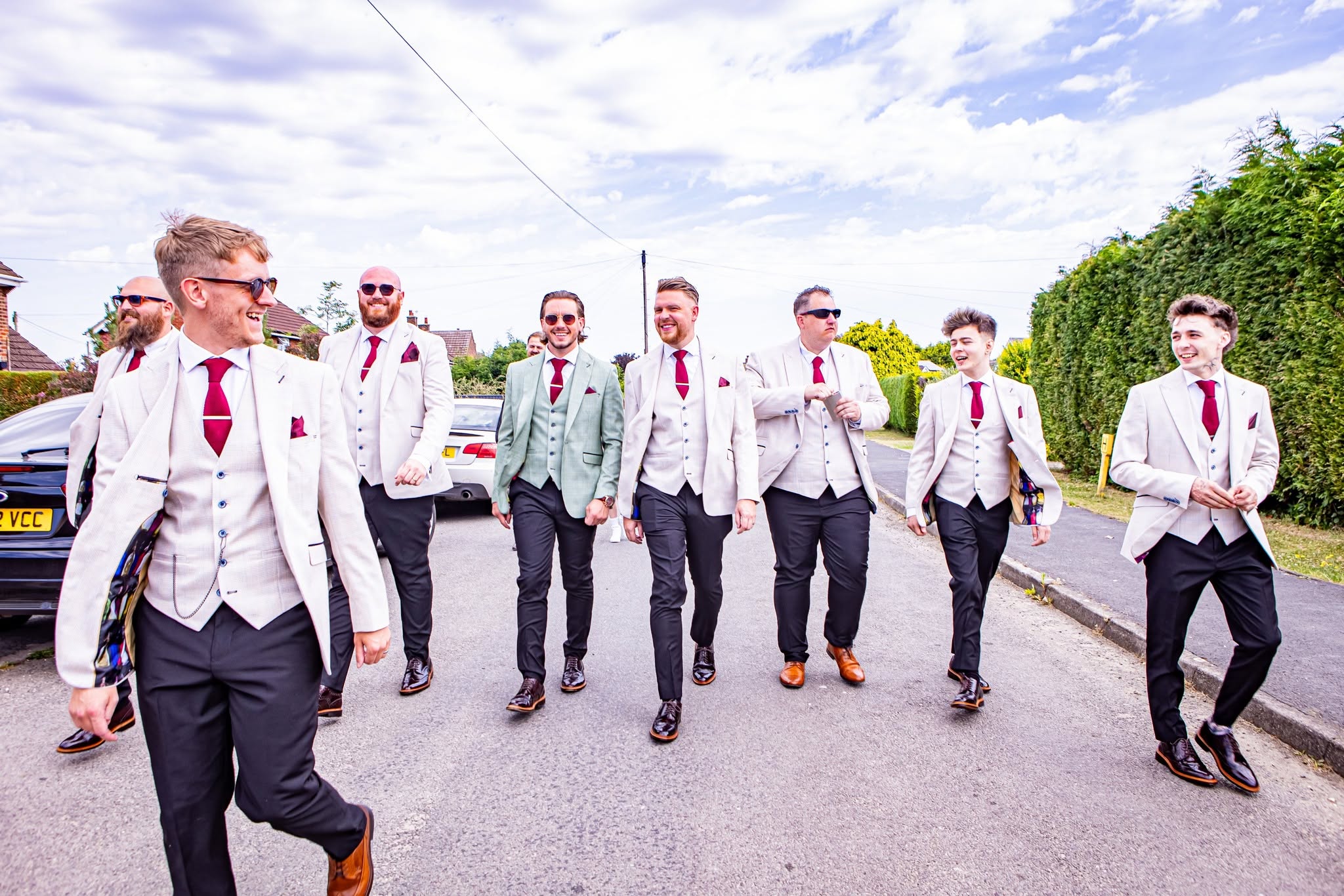 Groom and groomsmen laughing together